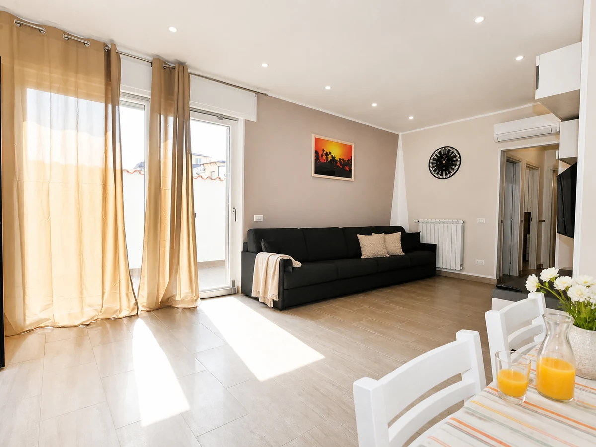 Bright Ponente living area with styled sofa and welcoming dining table
