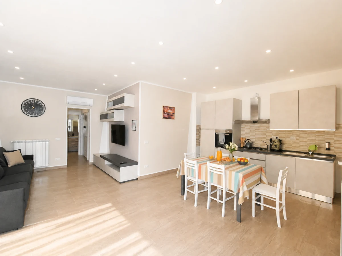 Open-plan kitchen and living area at Ponente apartment